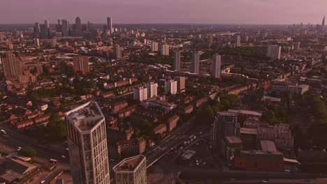 London-sunset-drone-orbiting-around-buildings-Canary-wharf