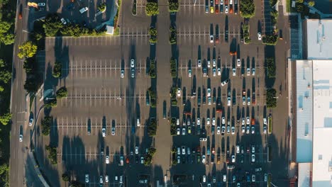 Aerial-view-of-a-parking-lot-with-many-cars-in-a-supermarket