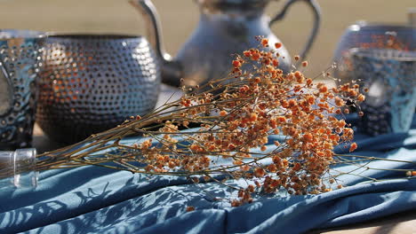 Decorative-boho-still-life-Moroccan-Tea-setting-on-empty-field---Close-up-detail-shot