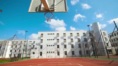Panning-shot-of-empty-Basketball-field-during-sunlight-and-blue-sky-in-Morocco