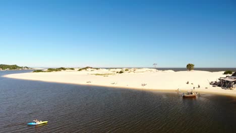 Drone-shot-over-a-river-and-beach