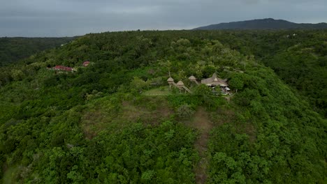 Tropical-resort-on-lush-hill-of-Nusa-Penida-with-idyllic-tree-houses