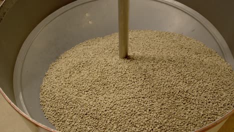 Industrial-coffee-bean-sorting-machine-with-beans-inside,-static-shot