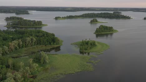 Drone-aerial-view-of-Rubikiai-lake,-Lithuania-nature