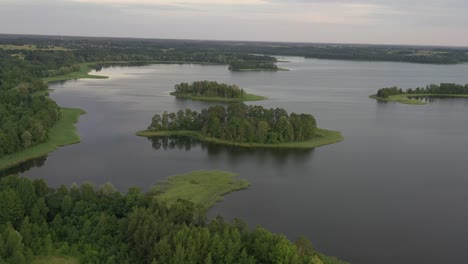 Drone-aerial-view-of-Rubikiai-lake,-Lithuania-nature