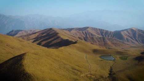 Beautiful-golden-mountain-landscape-of-the-Arashan-Mountains-in-Kyrgyzstan--Aerial