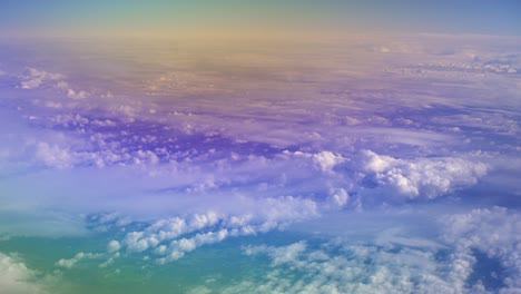 View-of-a-sky-horizon-from-a-plane-window-while-flying-over-a-blue-sky-filled-with-light-clouds,-holiday-escape