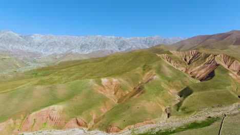 Beautiful-bright-green-mountain-landscape-of-the-Arashan-Mountains-in-Kyrgyzstan--Aerial