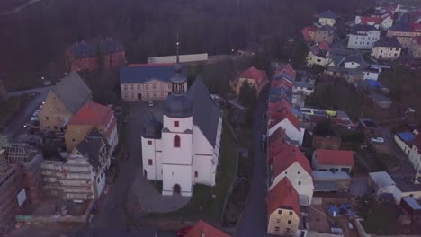Aerial-view-of-church-on-a-hill-in-an-old-medieval-German-town
