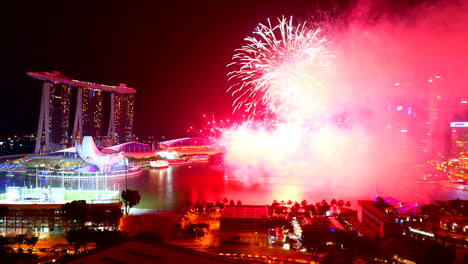 Singapore---Circa-Colorful-Fireworks-Over-Singapore-Bay-on-Clear-Night-With-Marina-Bay-Sands-Hotel-and-Traffic