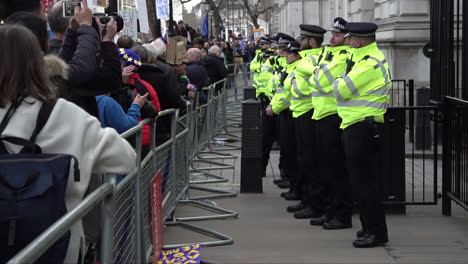 --A-line-of-police-stand-guard-outside-the-gates-of-Downing-Street-as-an-anti-Brexit-protest-passes