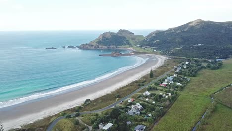 aerial-shot---flying-over-the-medlands-beach-in-great-barrier-island,-New-Zealand