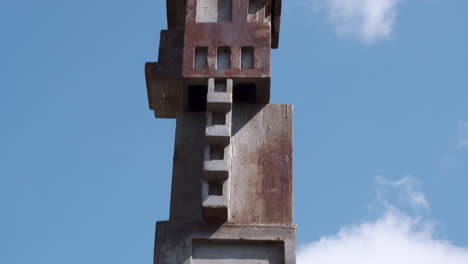 A-rising-tilt-up-the-length-of-a-sheet-metal-sculpture-located-at-Laumeier-Sculpture-Park-in-Saint-Louis,-Missouri