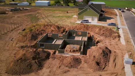 A-drone-shot-spinning-around-a-foundation-and-basement-walls-that-had-just-been-poured