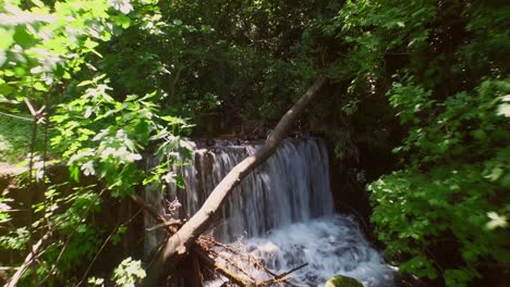 Aerial:-A-small-waterfall-in-a-forest-on-Samos-island