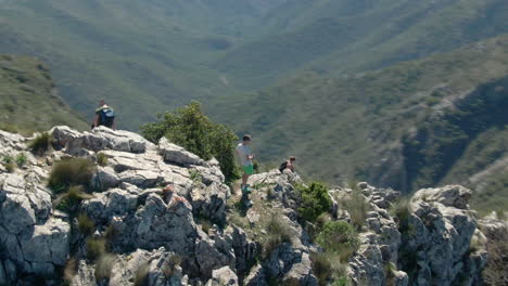 Scandinavian-tourists-hiking-towards-the-peak-of-la-concha-on-a-sunny-day-in-Spain