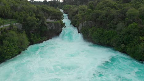 SLOWMO---Aerial-drone-ascending-shot-of-Hukas-Falls,-New-Zealand