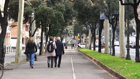 People-walking-by-in-Diagonal-in-Barcelona,-Spain