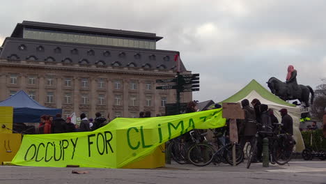 a-large-green-banner-waving-in-the-wind,-reading