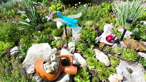 Blue-Bird-Wind-Toy-in-Garden