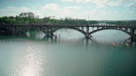 Paddleboarding-and-kayaking-under-a-bridge