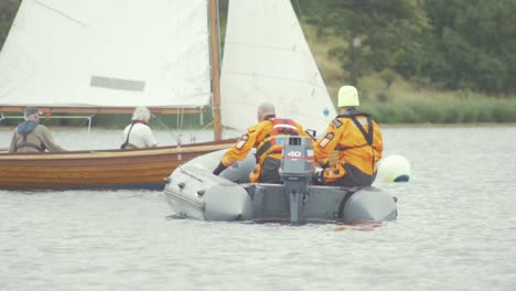 Irish-Civil-Defence-wadding-out-in-water-to-dinghys-on-Lake