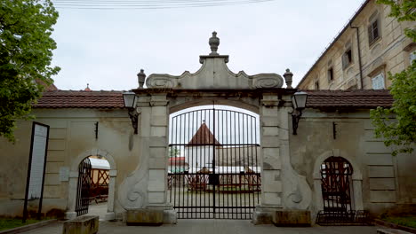 Renaissance-Baroque-palace-in-medieval-European-town,-Castle-in-Slovenska-Bistrica,-Slovenia-main-entrance-with-iron-gates