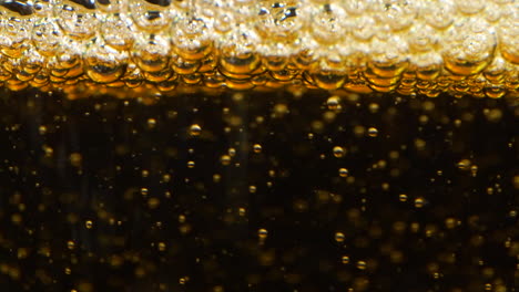 Extreme-close-up-of-Apple-Cider-Being-Poured-Into-Glass,-normal-speed