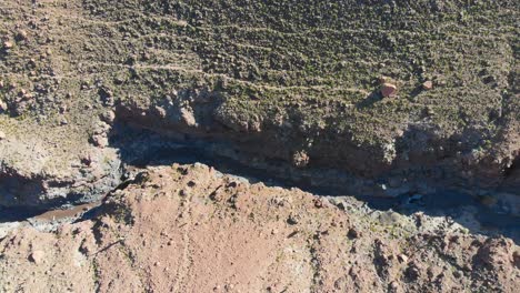 Aerial-cinematic-top-view-of-popular-giant-cactus-canyon-near-San-Pedro-de-Atacama-in-the-Atacama-Desert,-northern-Chile,-South-America