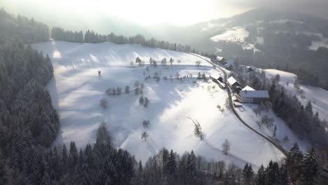 The-picturesque-church-of-Sveti-Tomaz-on-the-top-of-the-hill-in-central-Slovenia-during-winter
