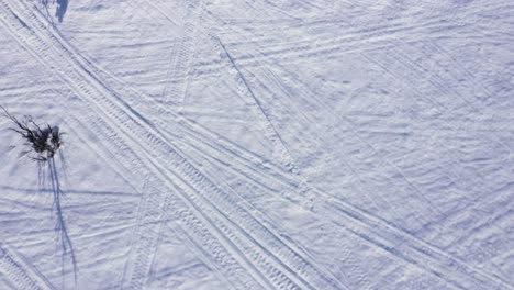 Aerial-view-of-man-skiing-down-a-hill