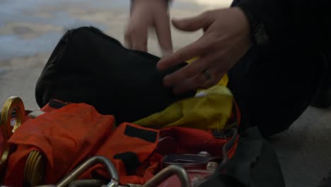 Firefighter-checks-gear-on-a-fire-truck-early-in-the-morning-to-prep-for-emergency-response