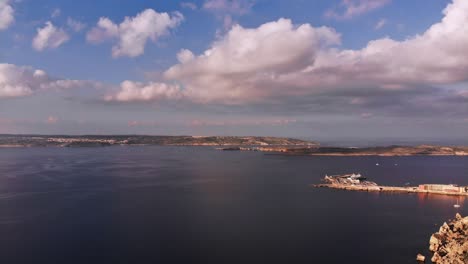 Hyperlapse-drone-video-from-Malta,-Mellieha-area,-flying-towards-Gozo-and-showing-the-beautiful-landscape-on-a-calm-autumn-afternoon