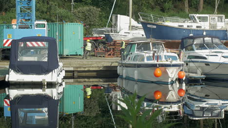 Crane-unloading-container-at-boat-yard