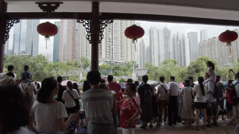 Chinese-people-the-show-from-the-pagoda-on-the-river-side-during-dragon-boat-festival-in-downtown-of-Guangzhou,-Guangdong,-China