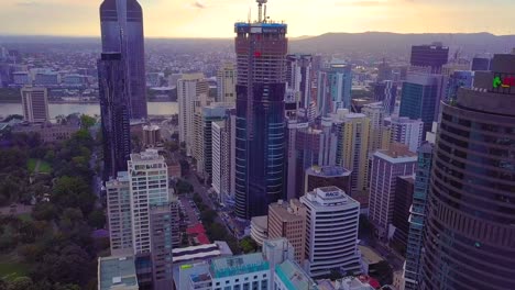 Fast-moving-aerial-timelapse-hyperlapse-of-a-Brisbane-city-center-by-the-river-at-sunset