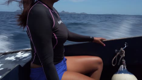 A-woman-enjoying-the-ride-of-a-speed-boat-on-its-way-to-Tobago-Cays-from-Carriacou,-Grenada