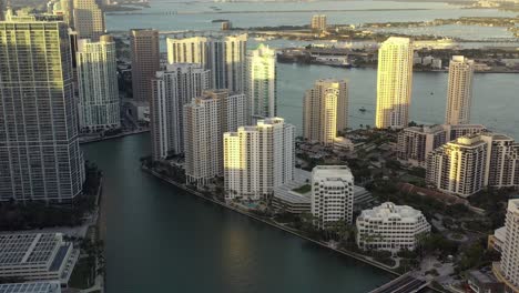 Cinematic-Aerial-Shot-of-Brickell-Key-In-Miami-Florida-at-Sunset-During-Golden-Hour