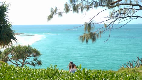 tourists-sitting-on-point-lookout-north-stradbroke-island,-Queensland,-Australia