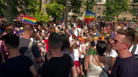 Colorful-people-getting-ready-to-march-in-the-Budapest-Pride,-panning-to-the-crowd
