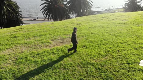 Aerial-man-walking-in-the-park-Montevideo-Uruguay