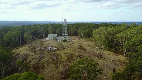 Drone-footage-flyby-forest-fire-tower-on-Blue-Mountain,-near-Newbury,-central-Victoria,-Australia