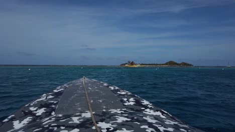 Speed-boat-on-its-way-to-happy-island,-a-man-made-island-in-Union-island,-St-Vincent
