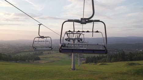 Panorama-with-empty-ski-lift-during-summer,-dolly-shot