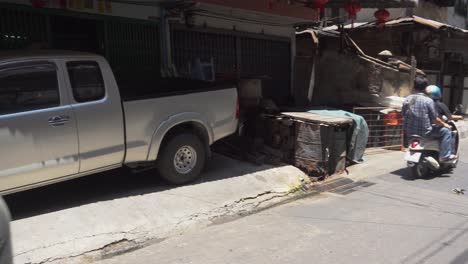 Urban-street-in-Bangkok-city-with-local-shops-in-small-alley,-Thailand