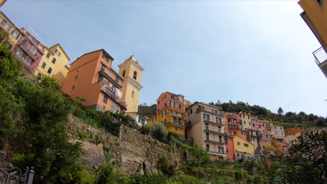 Walking-through-and-looking-up-the-hill-in-Manarola,-Cinque-Terre,-Italy