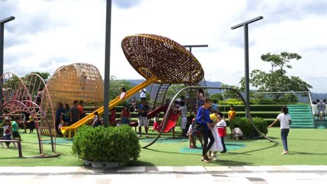 Supervised-by-parents-and-guardians,-frolicking-young-kids-explore-the-playground-attractions-at-SM-Seaside-Mall-on-South-Road-Properties,-Cebu-City,-Philippines