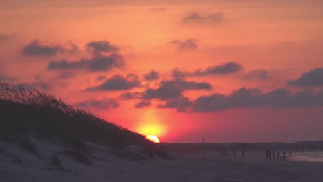Sun-rises-over-Bird-Island,-south-of-Sunset-Beach,-on-the-Outer-Banks-of-North-Carolina
