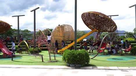 Supervised-by-parents-and-guardians,-frolicking-young-kids-explore-the-playground-attractions-at-SM-Seaside-Mall-on-South-Road-Properties,-Cebu-City,-Philippines