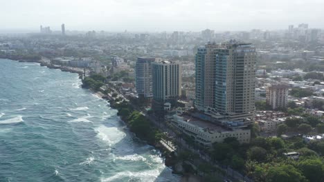Aerial-view-of-the-buildings-on-George-Washington-Avenue,-where-we-see-the-Malecon-Center-and-hotels-in-the-heart-of-the-city-of-Santo-Domingo